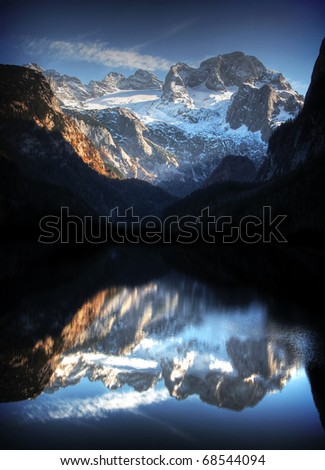 Beautiful mountain lake panorama with Dachstein Mountains in the background in Salzkammergut, Upper Austria, Austria