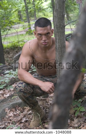 male model in military pants, in forest
