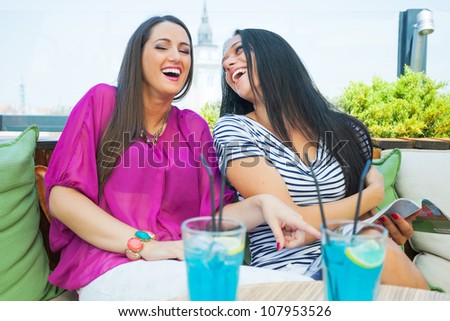 Two female friends in cafe