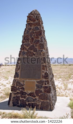 The first nuclear weapon (known as the trinity test) was detonated at this very spot.  It was 18 kilotons and is about 200 miles south of Los Alamos in New Mexico.