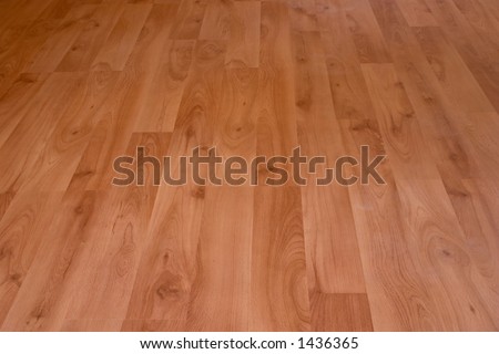 A brand new laminate floor with a birch grain