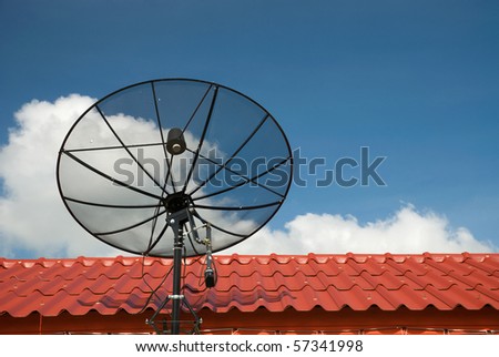 the satellite dish on red roof