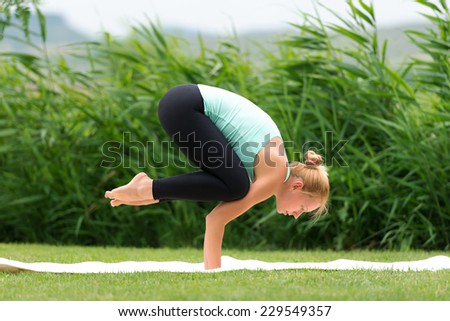 Woman making yoga crow pose