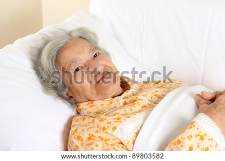 Senior woman in the hospital bed