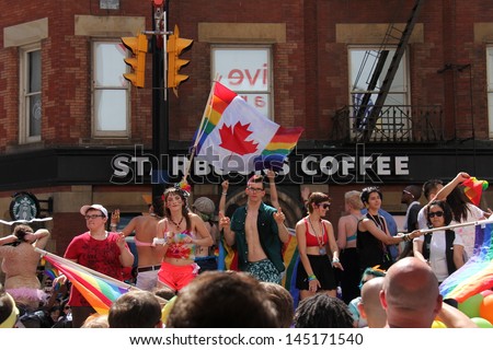 TORONTO - JUN 30 : Performers and attendees at a gay pride parade. Part of pride week, a 10 day event in celebration of the diversity of the LGBT community. in downtown Toronto, June 30, 2013.