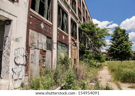 DETROIT, MICHIGAN - NOV 21: Abandoned Packard factory ruins on a sunny afternoon on November 21, 2012. Abandoned in 1958, the buildings still stand in a decayed state of beauty.
