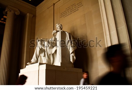 Lincoln Memorial Statue. The famous Lincoln Memorial Statue shot in long exposure with the quote visible above and blurred tourists.