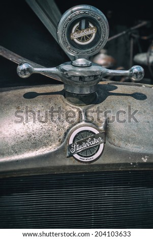 MISSISSAUGA, CANADA - JULY 7 2014: The emblem and hood ornament on the front of a classic Studebaker.  As seen at \