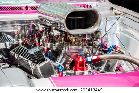 MISSISSAUGA, CANADA - JULY 6 2014: Souped up super-charged hot rod engine with pink. As seen at \
