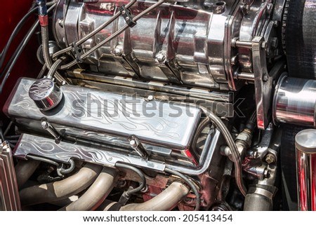 MISSISSAUGA, CANADA - JULY 6 2014: Souped up super-charged hot rod engine with chrome flames. As seen at \