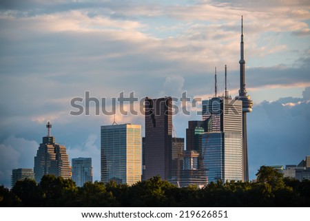 Toronto Skyline No Logos. The skyline of Toronto, Canada as seen from the Danforth area. Shot at dusk and rendered naturally. All logos and recognizable trademarks have been edited out.