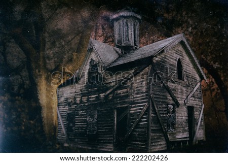Haunted Halloween House 1. An old Halloween haunted house in the spooky woods with a skeleton in the window.