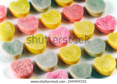 Candy Hearts Valentine\'s Day. Valentine\'s Day candy hearts in rows. Bright colors on white