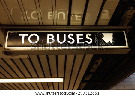 To Buses. Sign indicating \