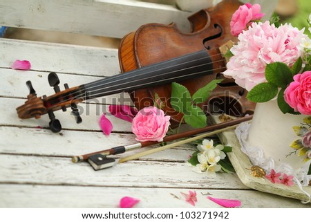 antigue violin, notes and spring bouquet