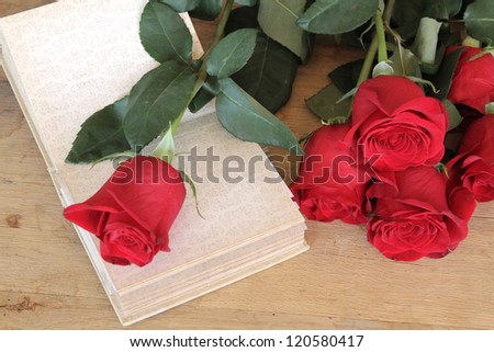 red roses and open book
