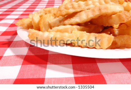 Fries on a picnic table cloth red