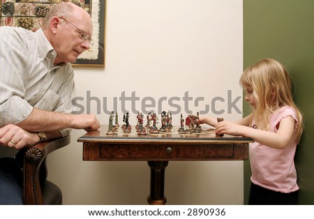 stock-photo-wise-grandfather-and-adorable-grand-daughter-learning-to-play-chess-2890936.jpg
