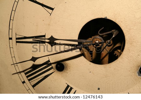 Antique looking grandfather clock face with gears