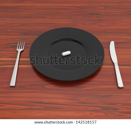 single pill on a black plate on wooden tabletop