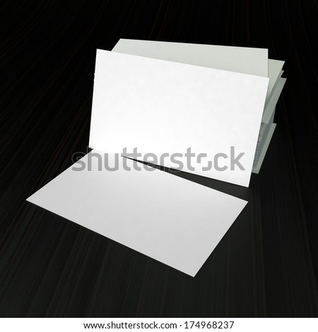 blank white visit cards on dark wooden background