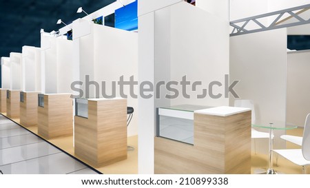 exhibition pavilion interior with workplaces and white walls