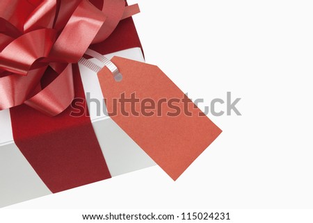 Christmas present with blank gift tag, includes clipping path