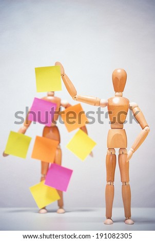Artists mannequin covered in sticky notes
