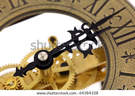 Close up of old-fashioned wall clock with visible gears, isolated on white background. Intentional shallow depth of field. Studio work.