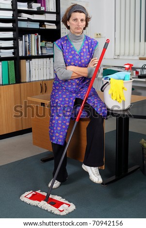 Portrait of professional cleaning lady.