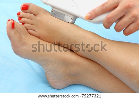 Laser hair removal on lady\'s legs. Intentional shallow depth of field.