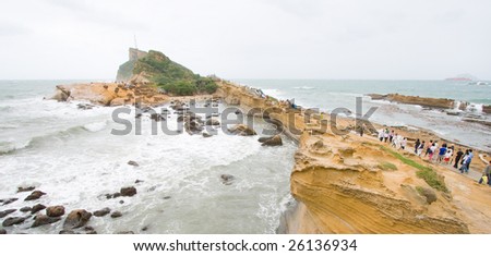 Waves wash up alongside the Yehliu geo park coastline taken from above