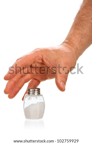 Hand taking salt cellar isolated on white background