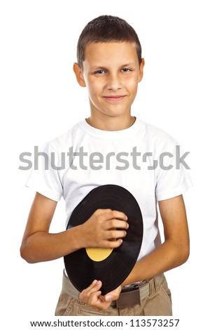 Boy in white shirt holding vinyl record and smiling. Isolated on white background