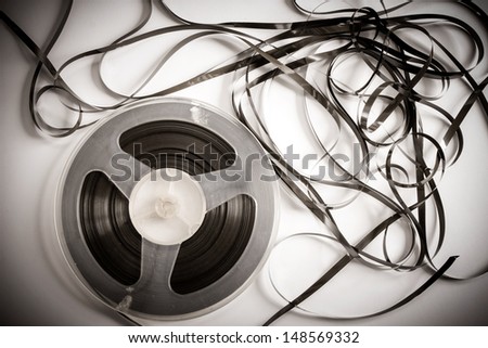 Old magnetic tape reel with loose tape
