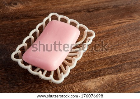 Pink soap on a brown wooden table
