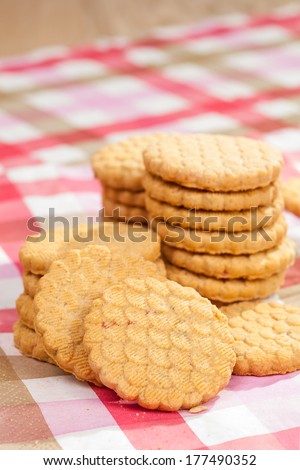Round cookies on a striped tablecloth