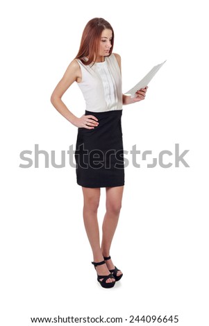 Young woman in black skirt and white shirt reading list of paper isolated over white background