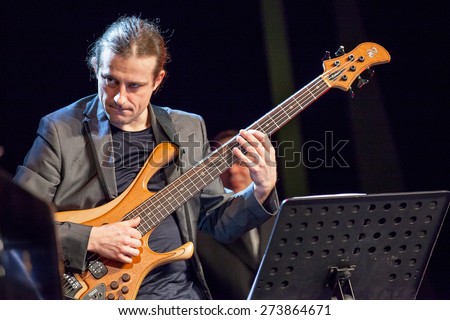 KAUNAS, LITHUANIA - APRIL 24, 2015: Polish electric bass player Pawel Panta performs at the stage of \