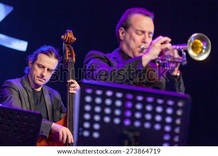 KAUNAS, LITHUANIA - APRIL 24, 2015: Double bass player Pawel Panta and trumpetist Gary Guthman perform at the stage of \