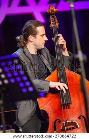 KAUNAS, LITHUANIA - APRIL 24, 2015: Polish double bass player Pawel Panta performs at the stage of \