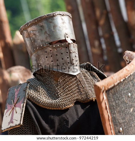 Medieval knight with helmet and shield