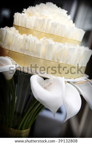 stock photo Calla Lily holding Wedding Cake