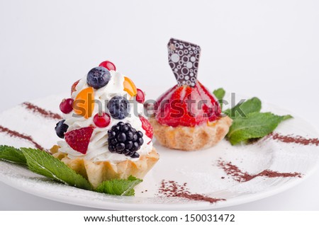 A delicious creamy cake with berries. A delicious dessert with whipped cream. Shallow depth of field