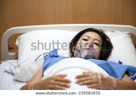 Mom in mask oxygen after childbirth