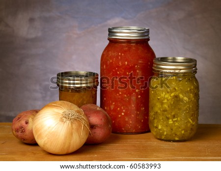 Canned vegetables on old distressed counter with a neutral background
