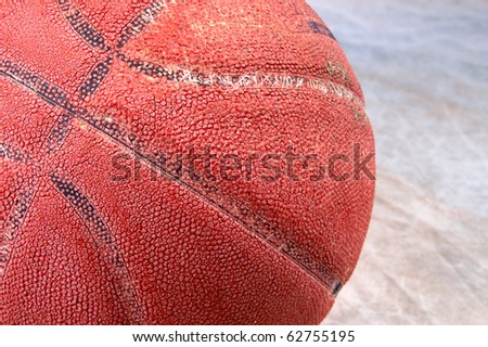 Vintage basketball on brown back drop with copy space ball is very cracked and aged with texture