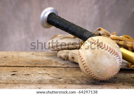 Baseball, bat, and mitt on old vintage wood table with copy space
