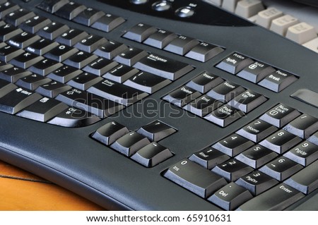 Old dirty computer keyboards in a stack