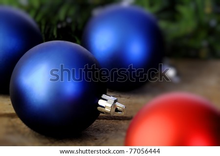 Red and blue Christmas balls on an old vintage table